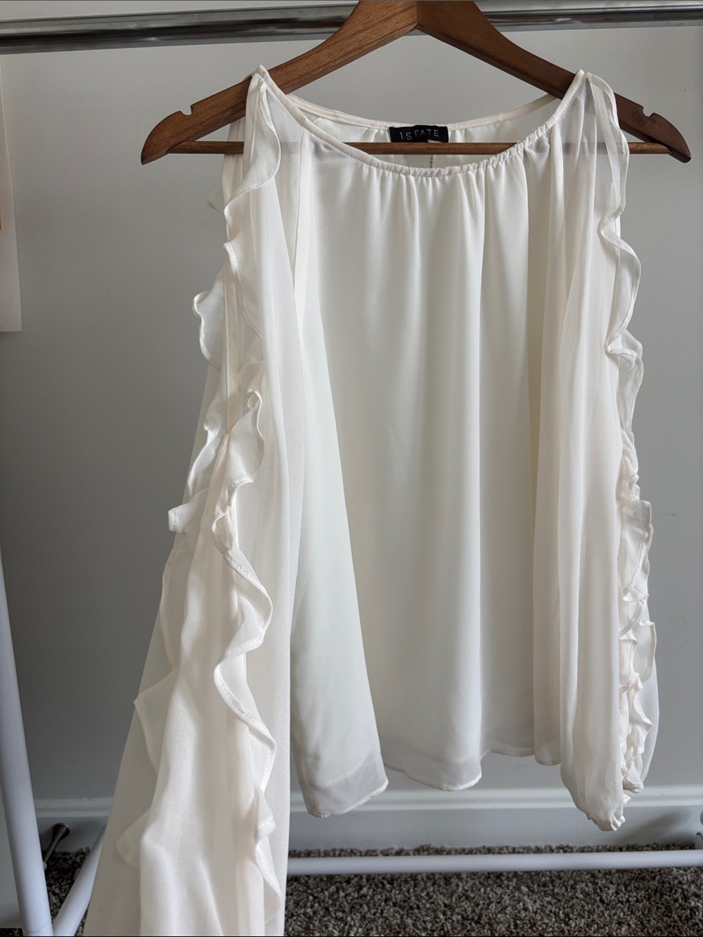 1. State Ivory Ruffle-Trim Sleeveless Blouse